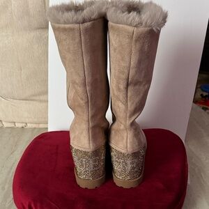 Guess Faux Suede wedge boots featuring a glittery rhinestone logo on the heel.